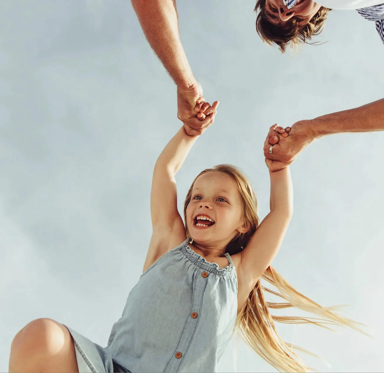 A happy girl child playing with Father